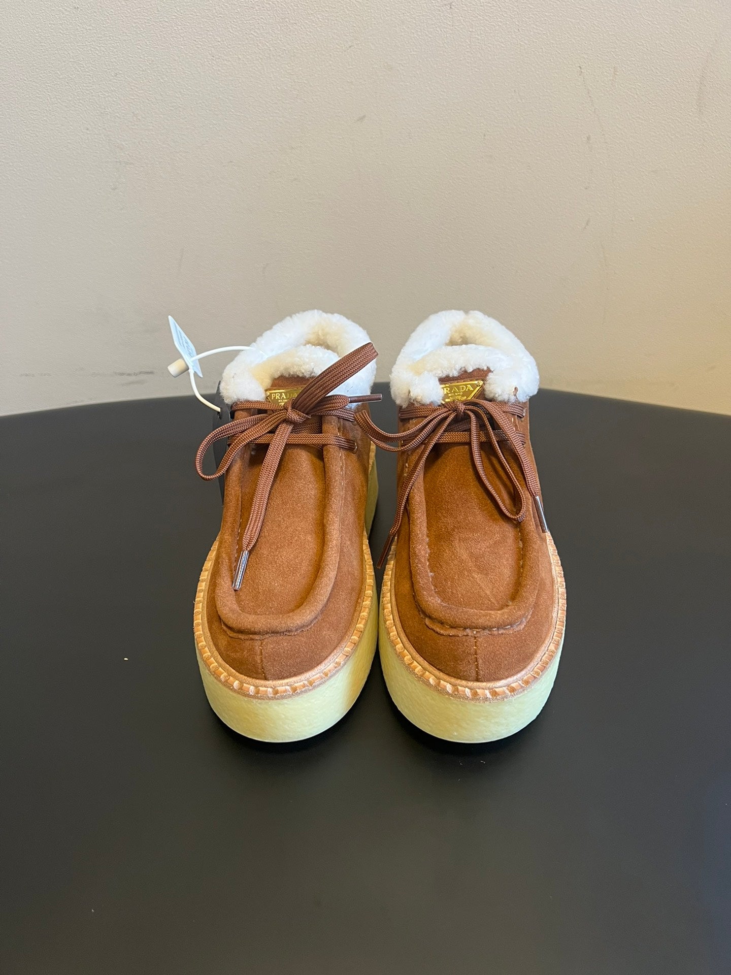 PRADA 25S HIGH-TOP SHOES 40 MM IN BROWN SUEDE SHEARLING-LINED