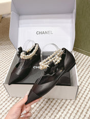 CHANEL 25S ESPADRILLE FLATS IN BLACK CALFSKIN WITH PEARL STRAP